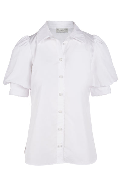 white blouse with black buttons